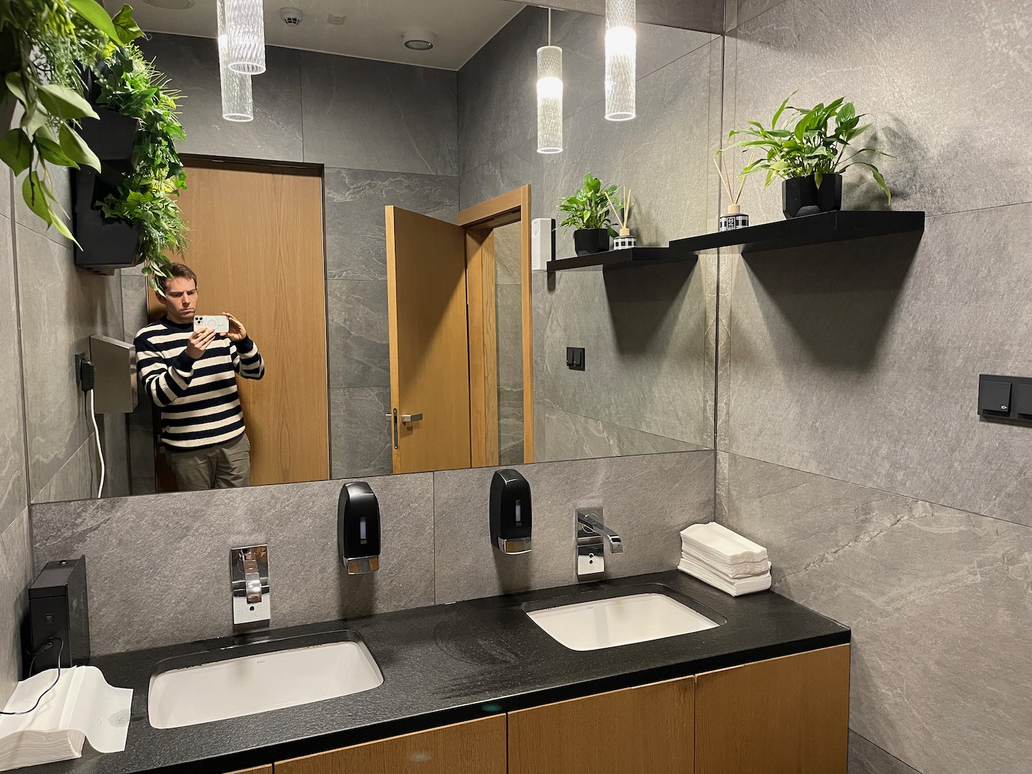 a man taking a selfie in a bathroom