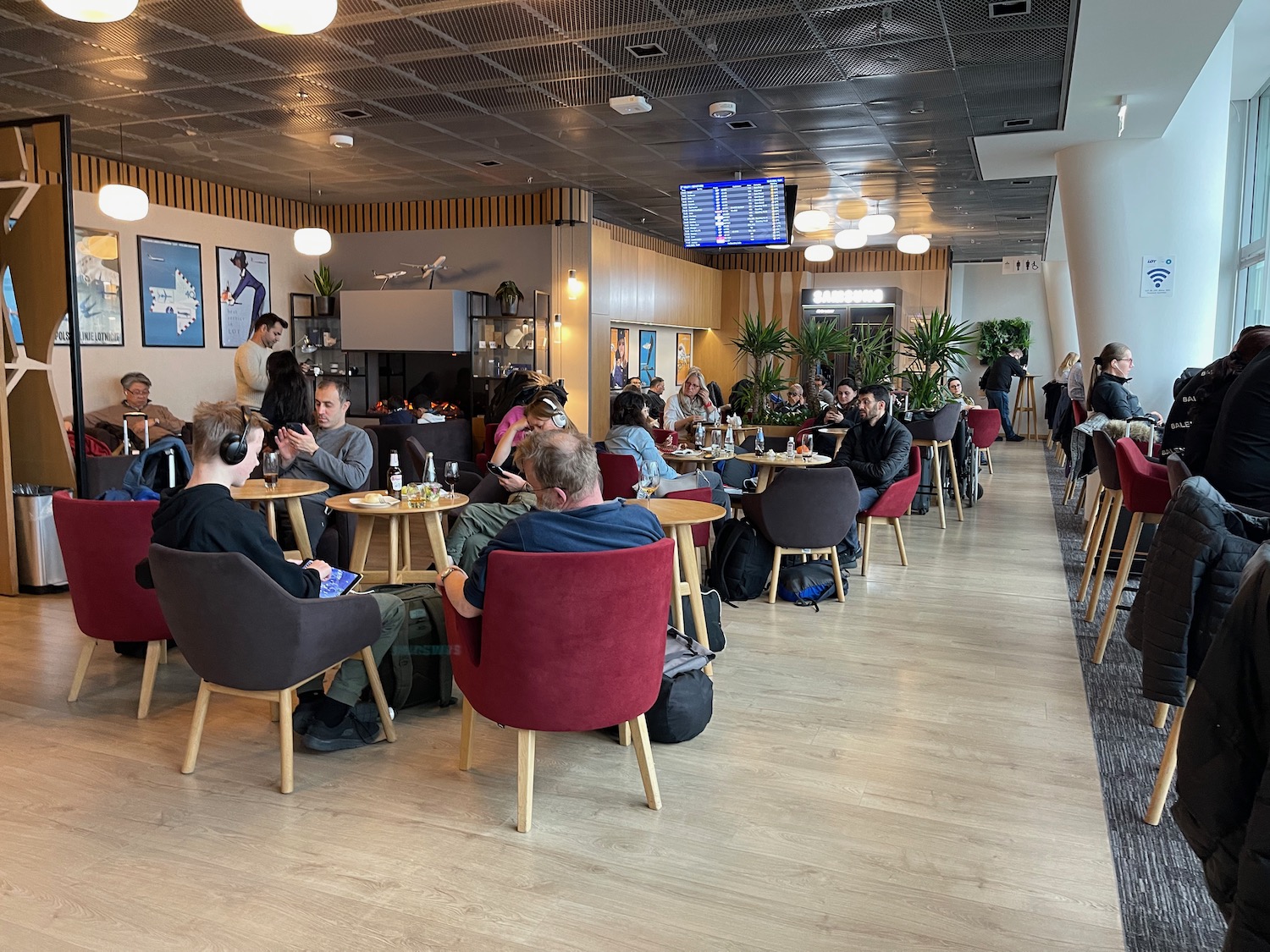 a group of people sitting at tables in a room