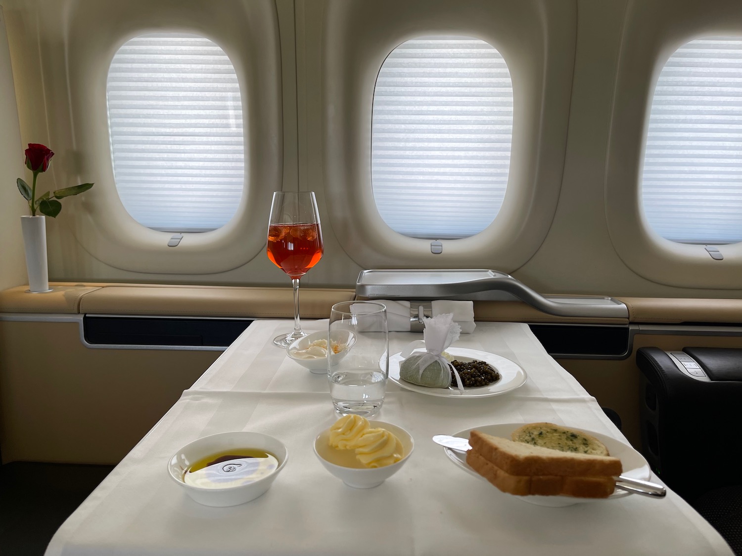 a table with food on it and a glass of wine on it