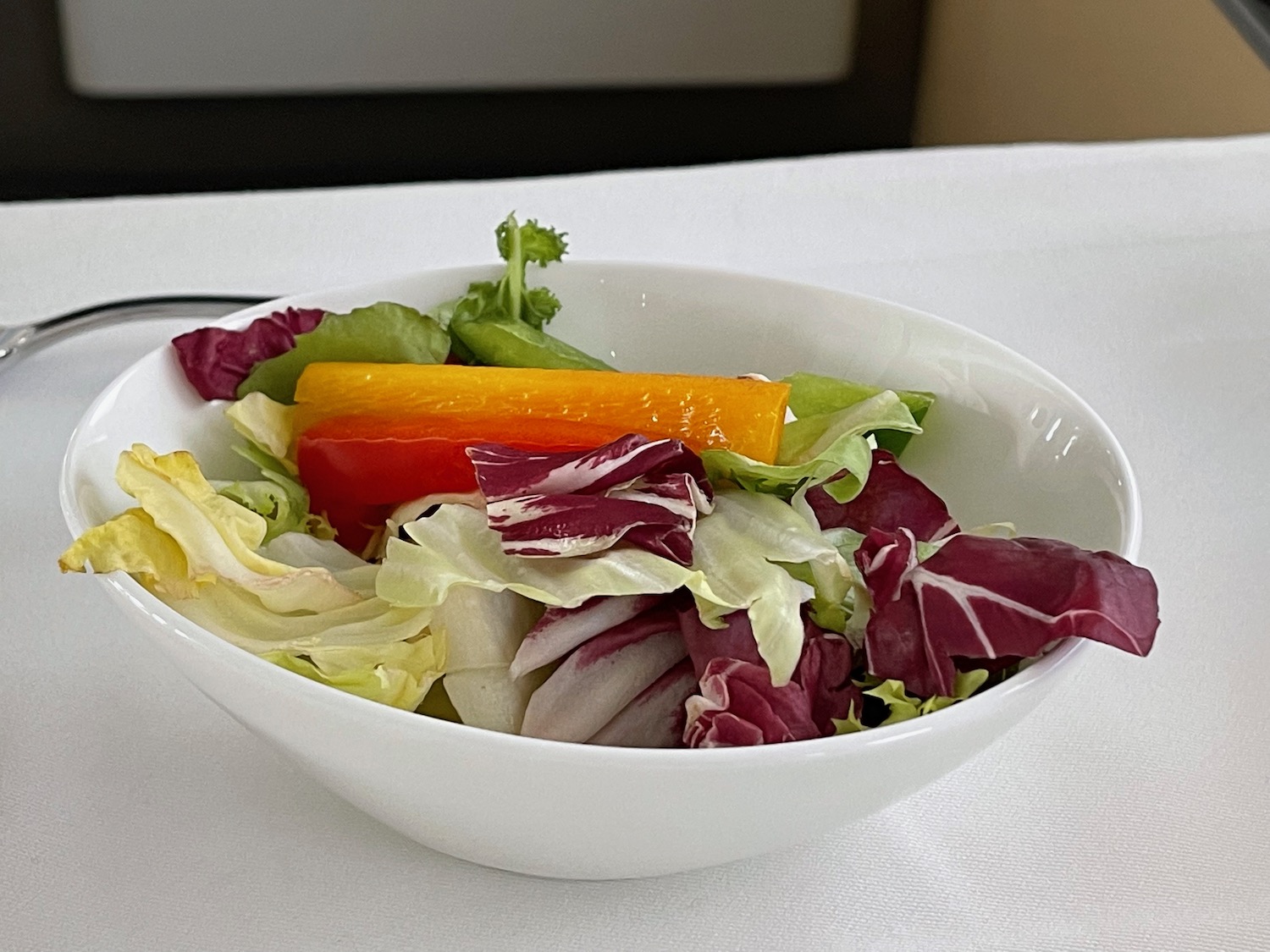 a bowl of salad with a fork