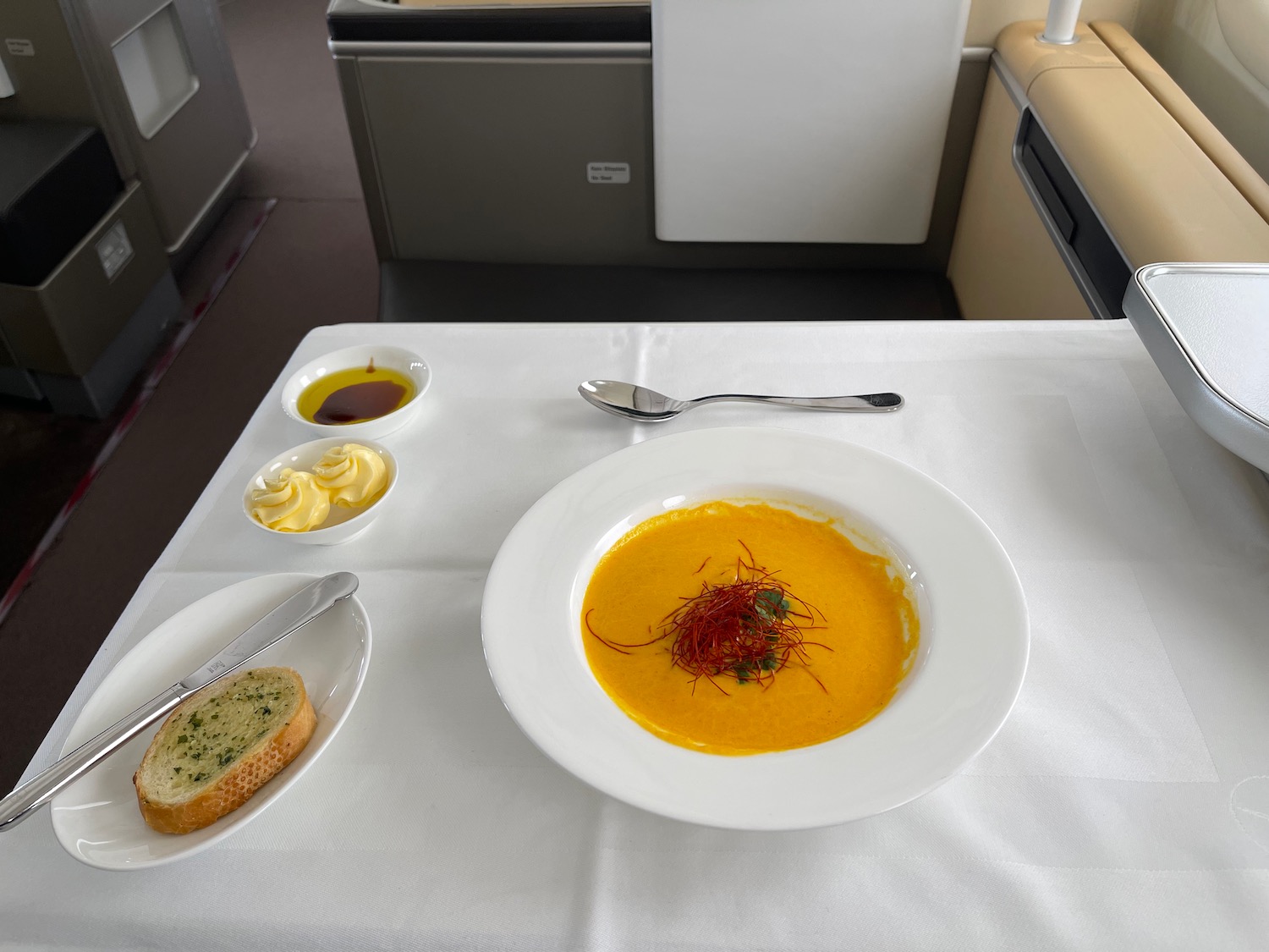 a plate of soup and bread on a table