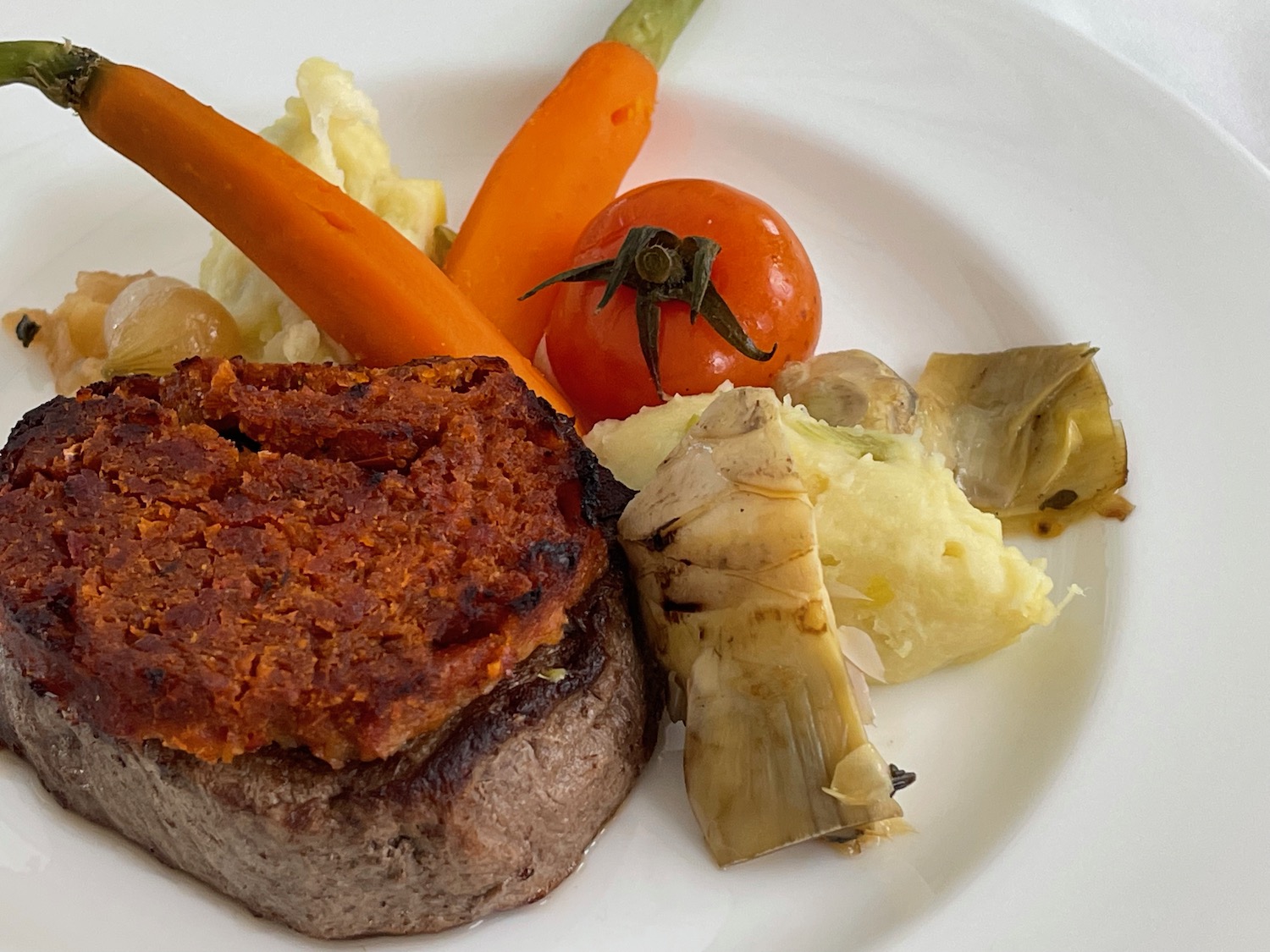 a plate of food with vegetables