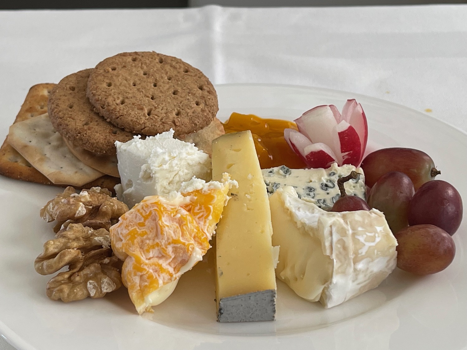 a plate of cheese and fruit