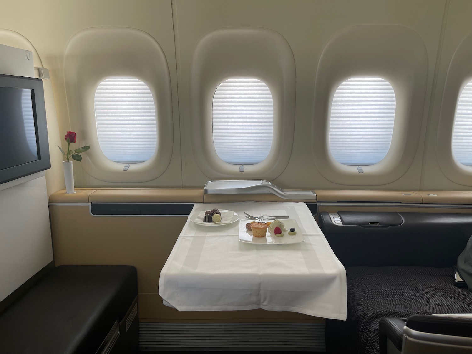 a table with food on it in an airplane