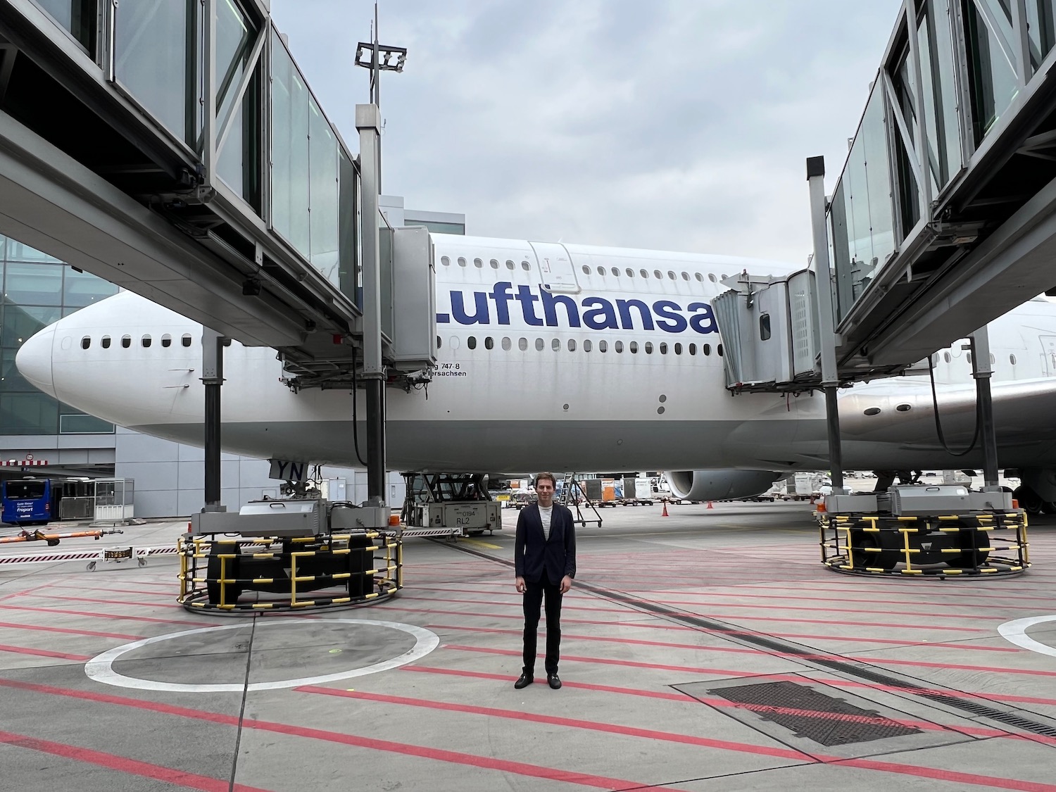 a man standing in front of an airplane