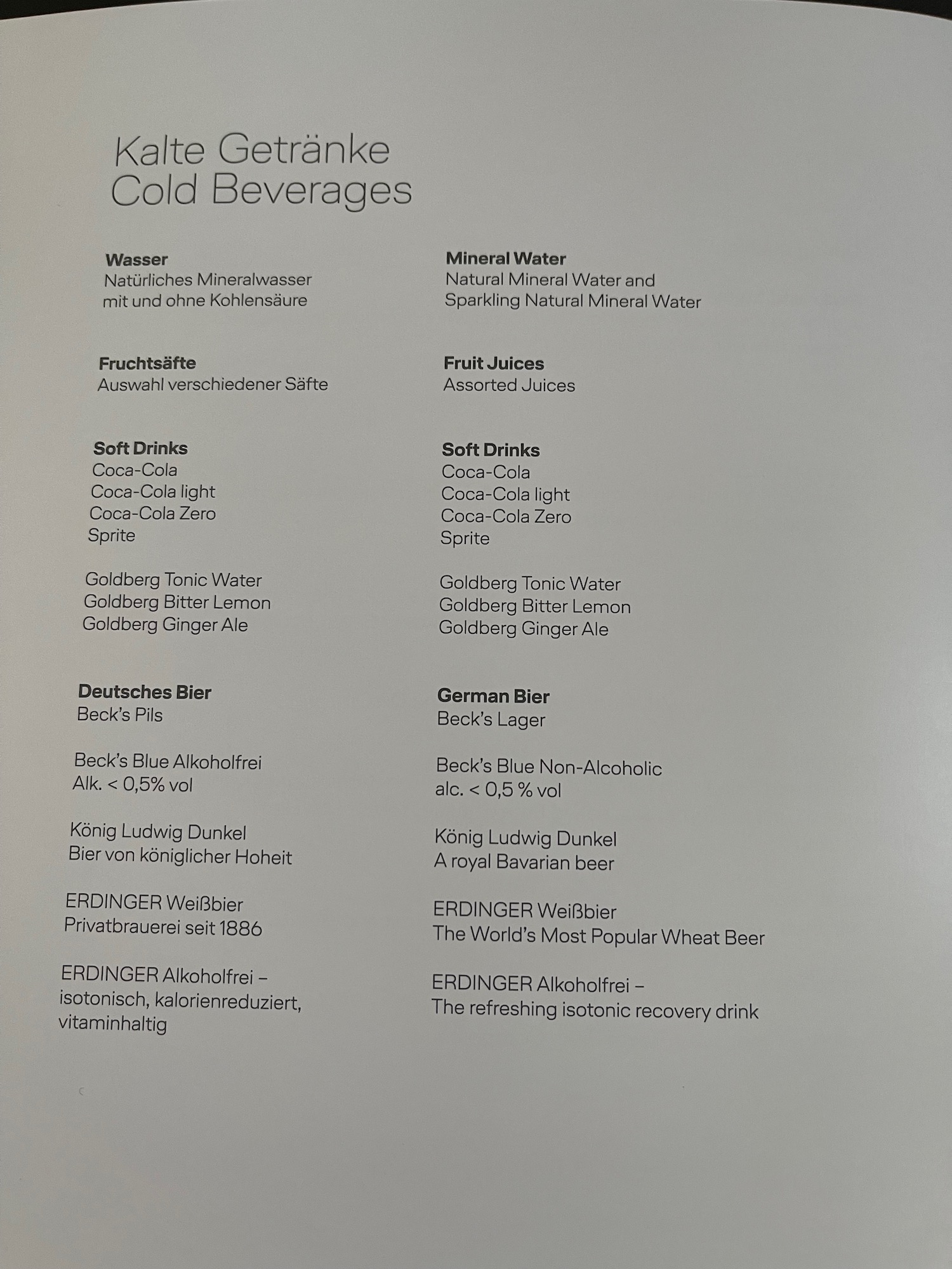 a menu of drinks on a white surface