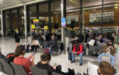 a group of people sitting in a waiting area