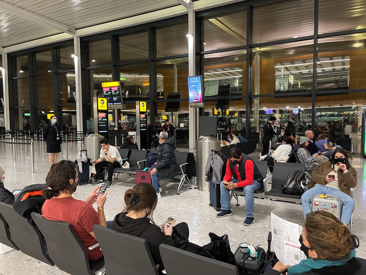 a group of people sitting in a waiting area