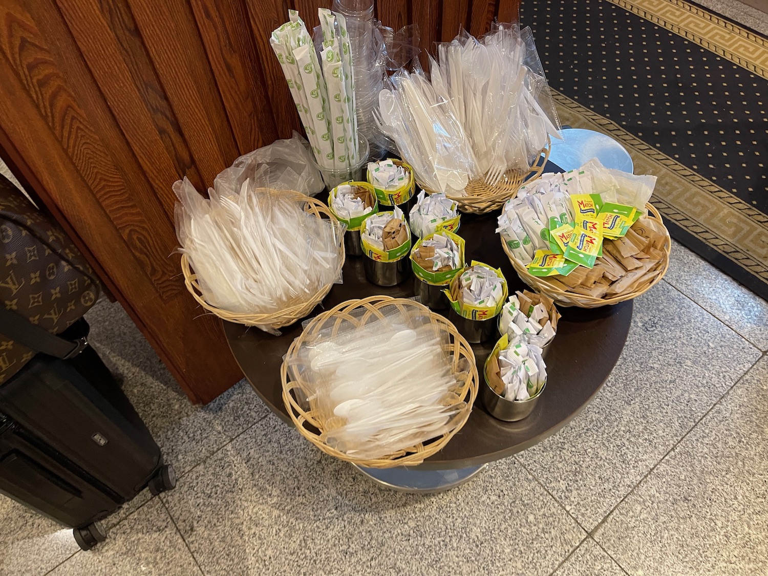 a table with baskets of food and utensils