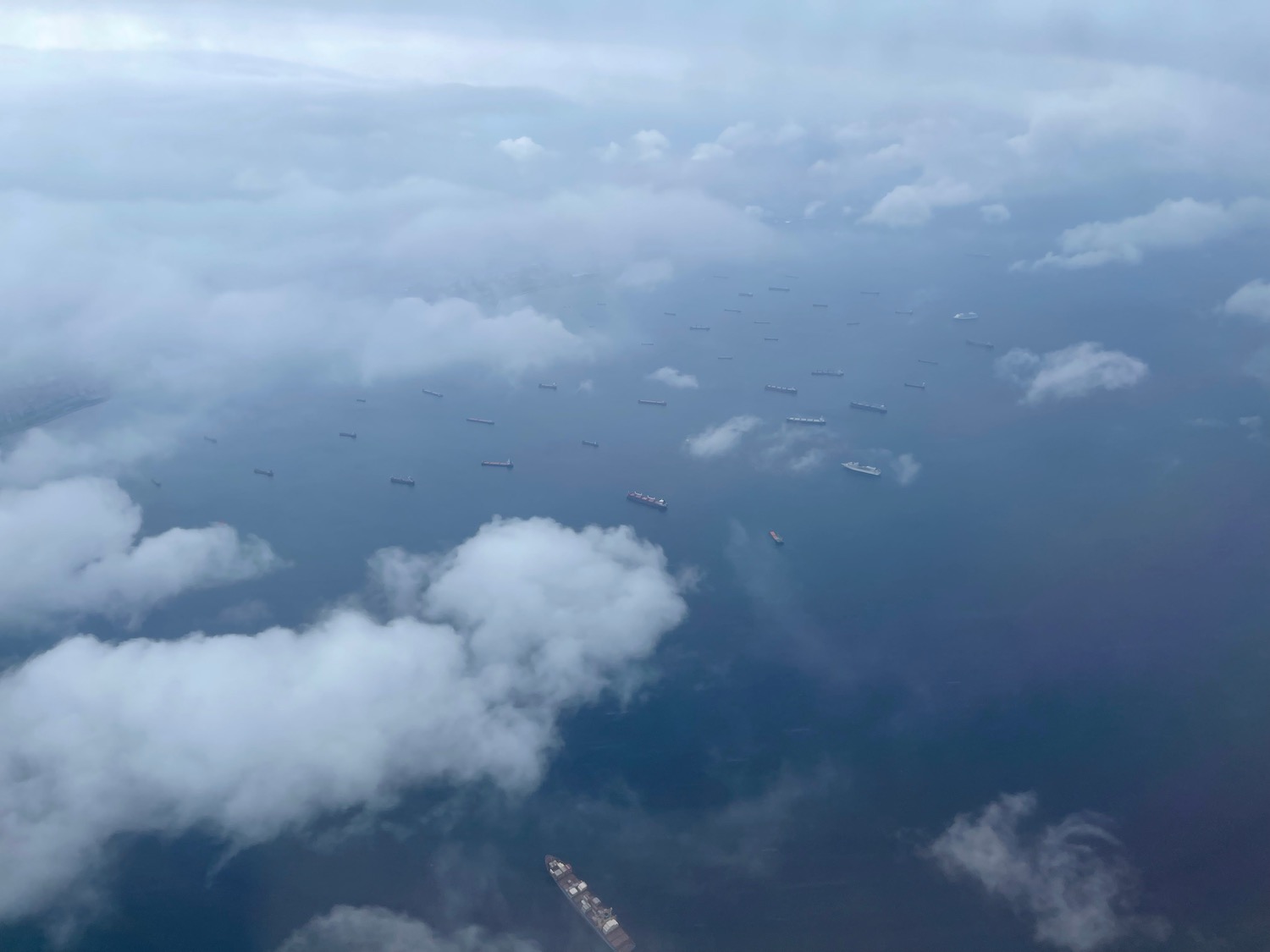 ships in the water with clouds