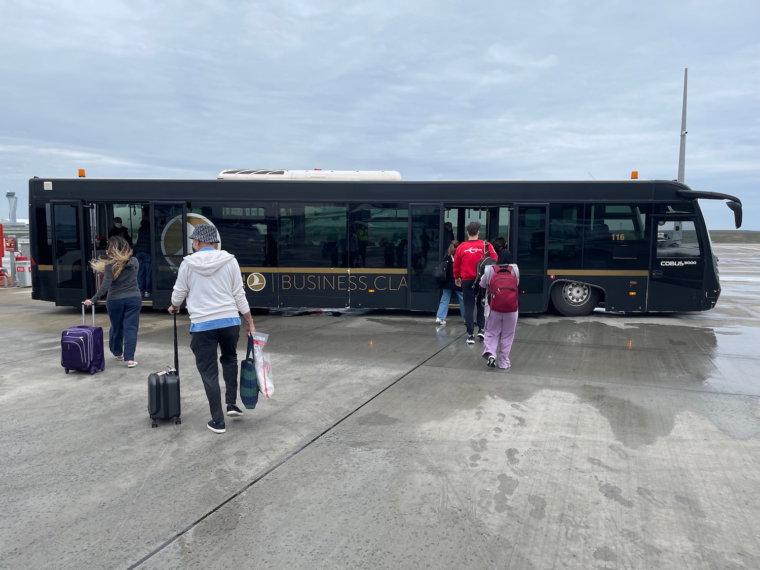 people boarding a bus