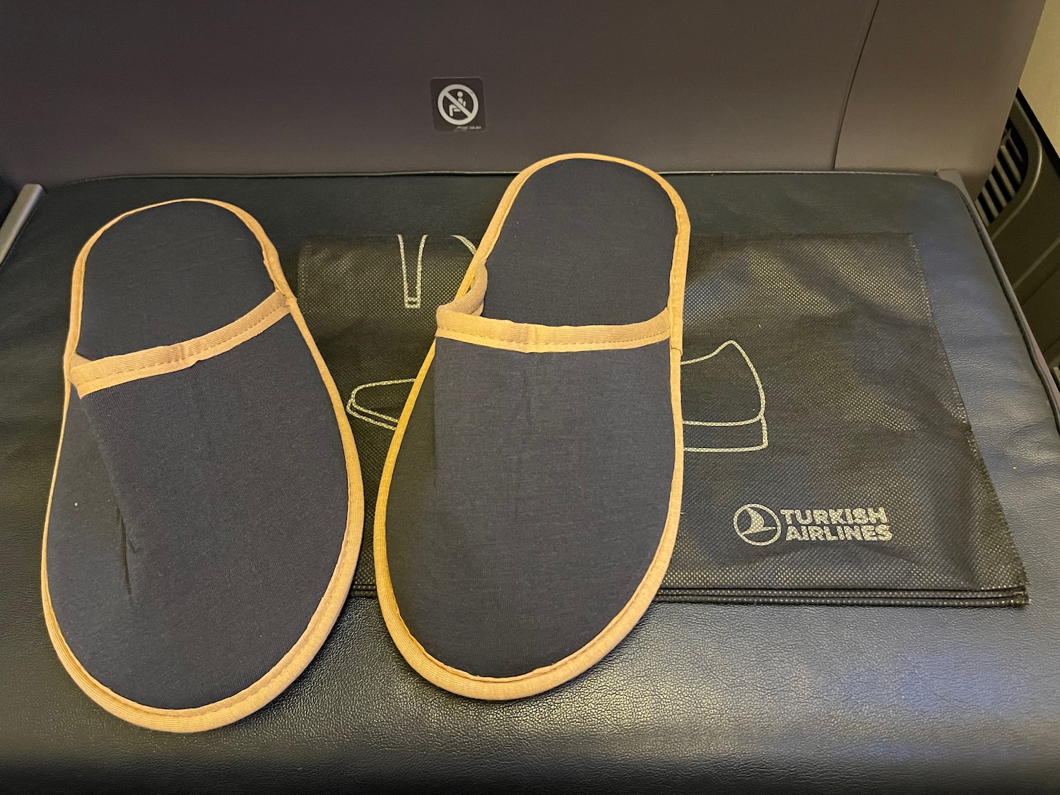 a pair of slippers on a black surface