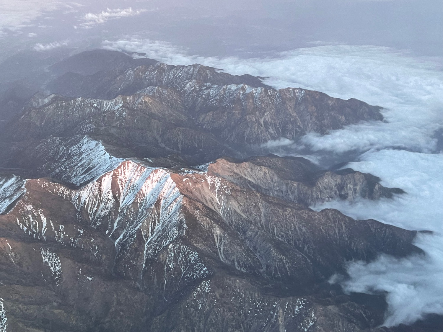 a mountain range with snow on top