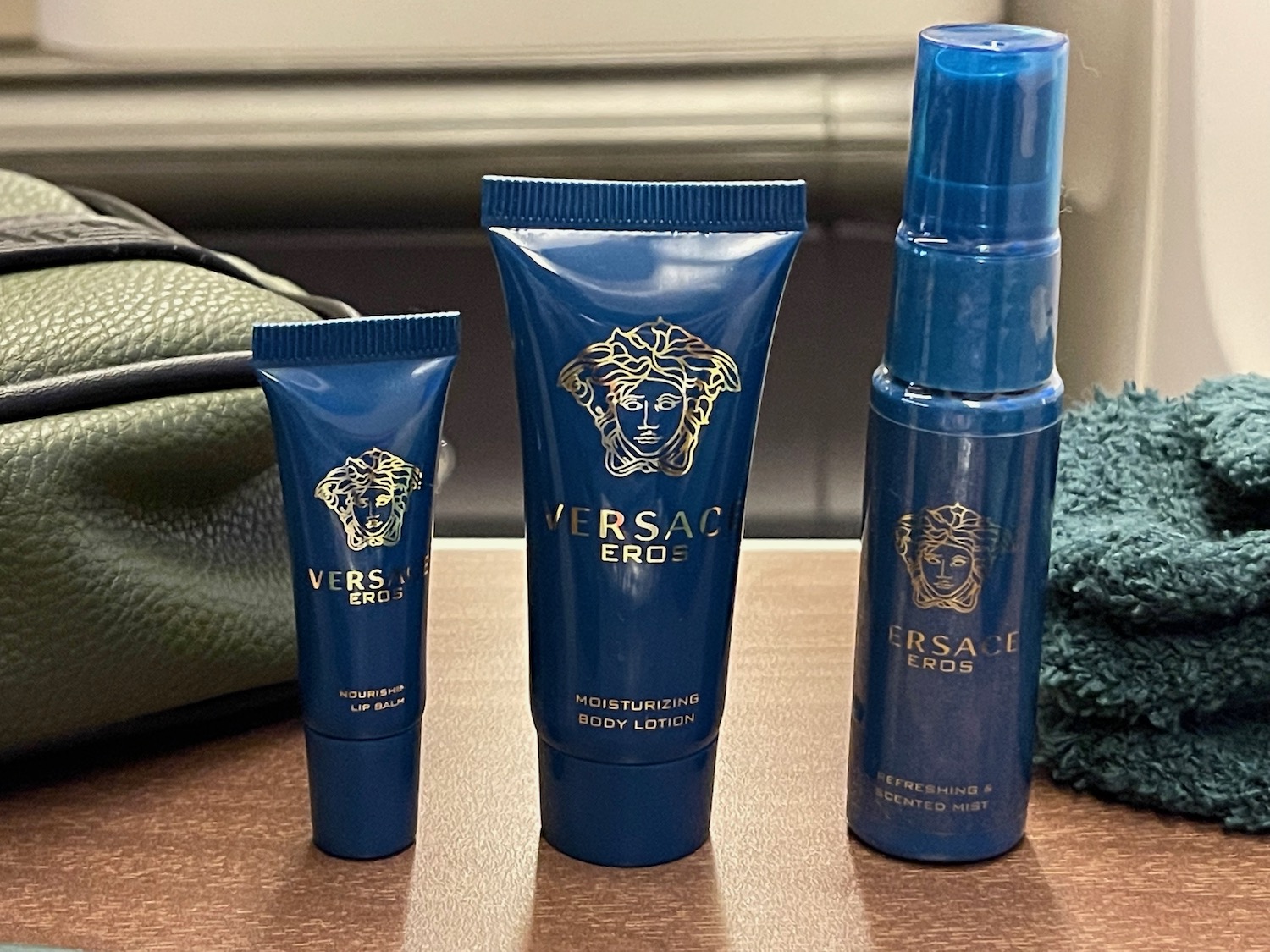 a group of blue bottles and a blue bottle of body lotion