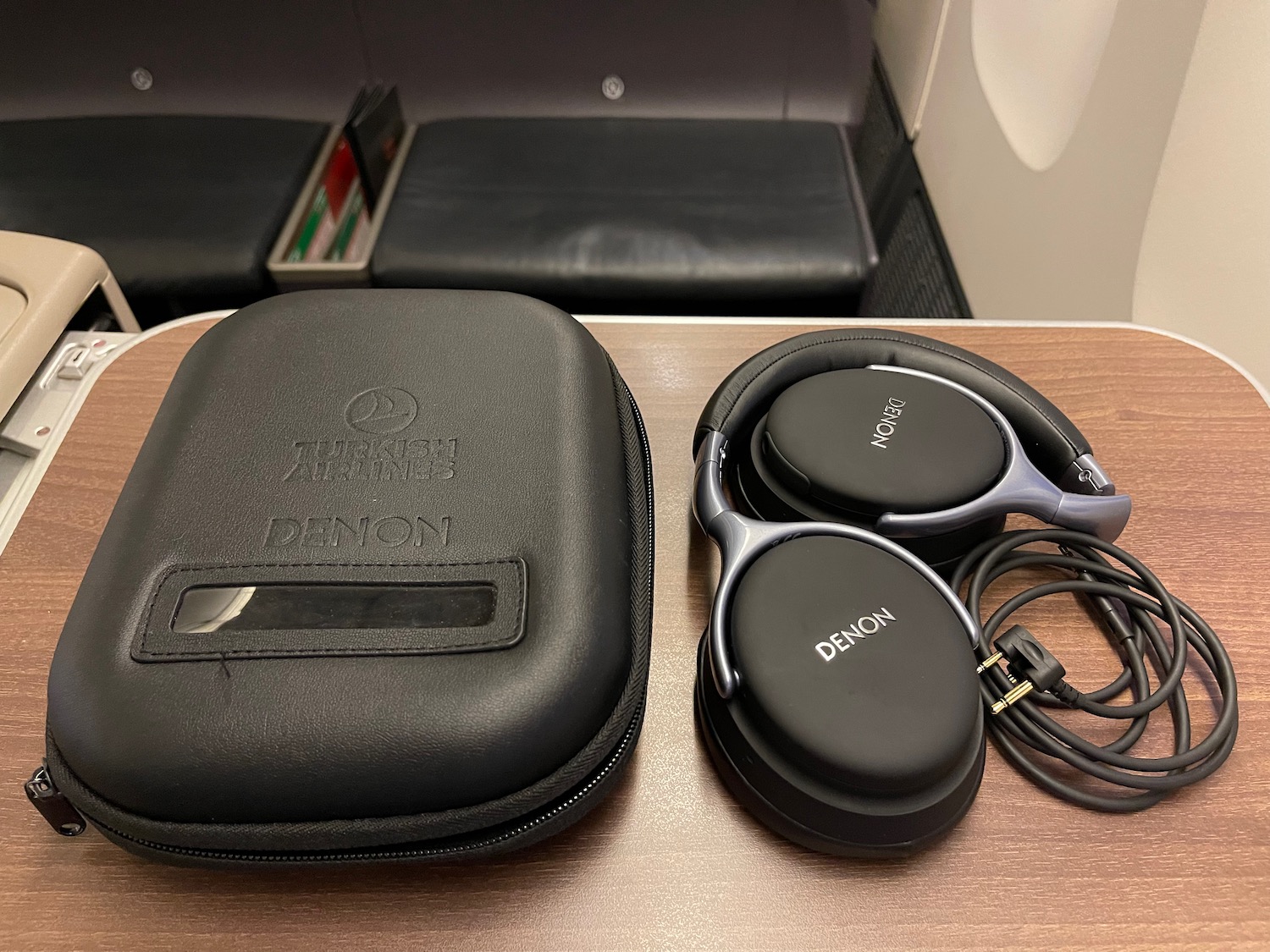 a pair of headphones next to a case