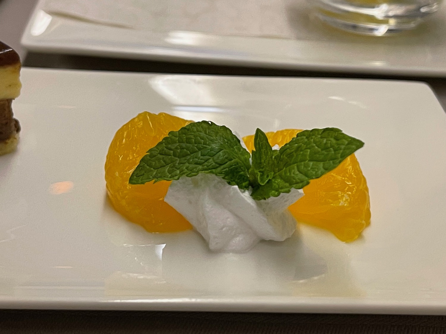 a plate of oranges and mint
