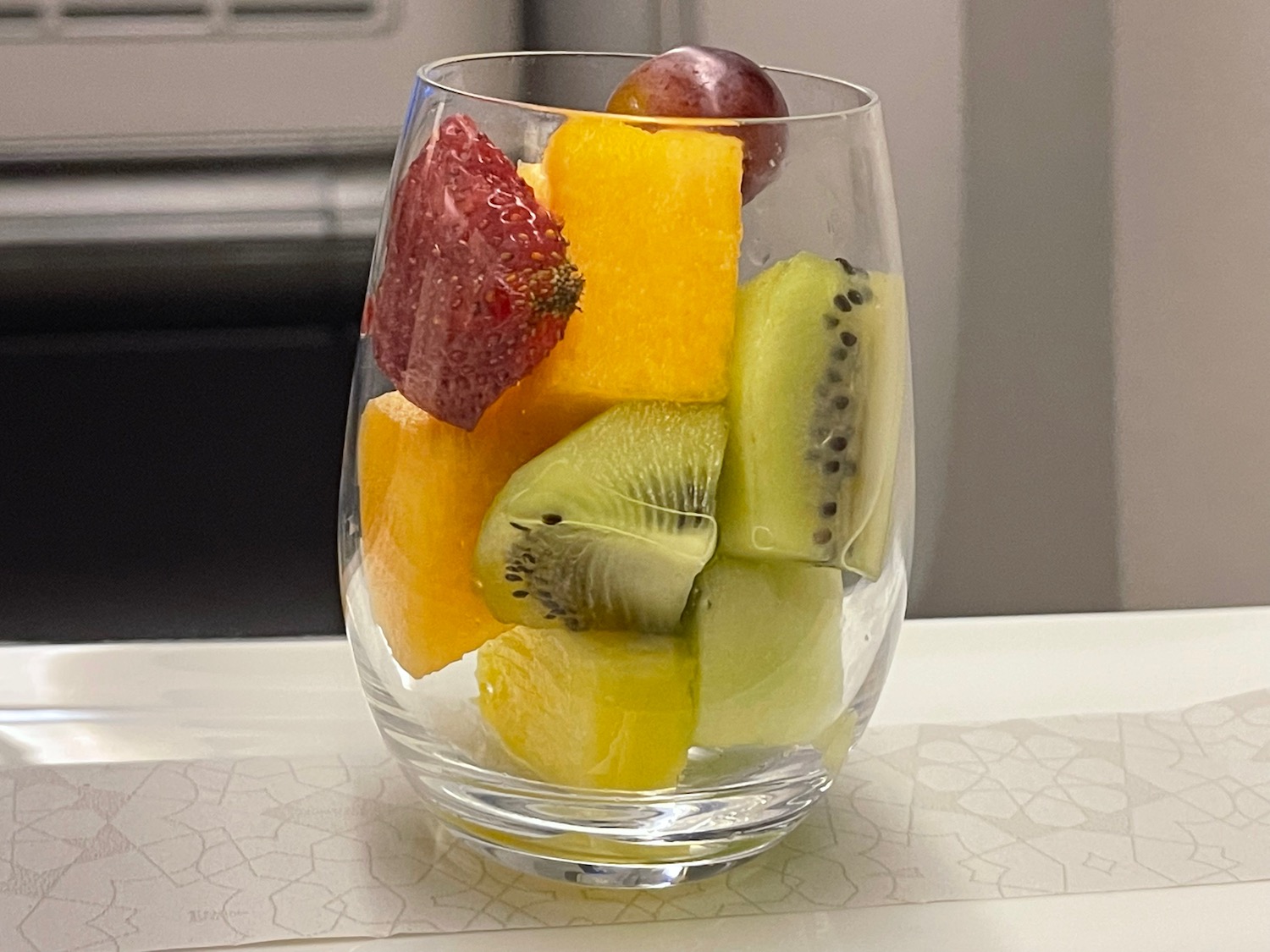 a glass of fruit in a glass