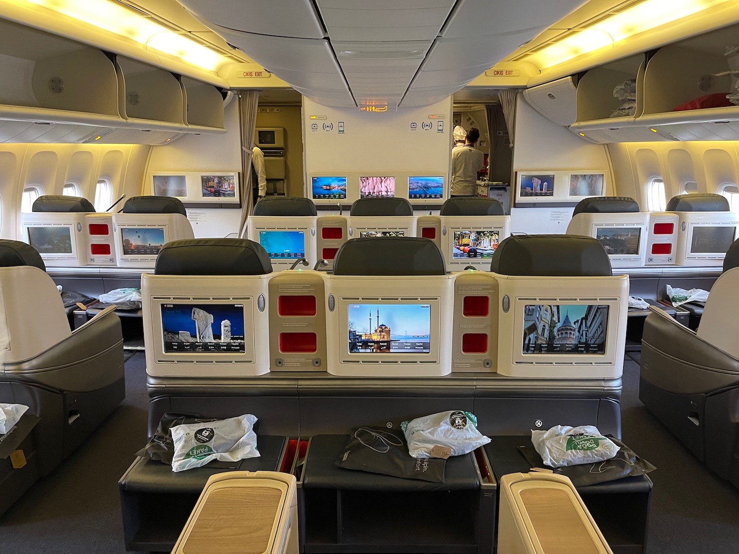 a row of monitors in an airplane