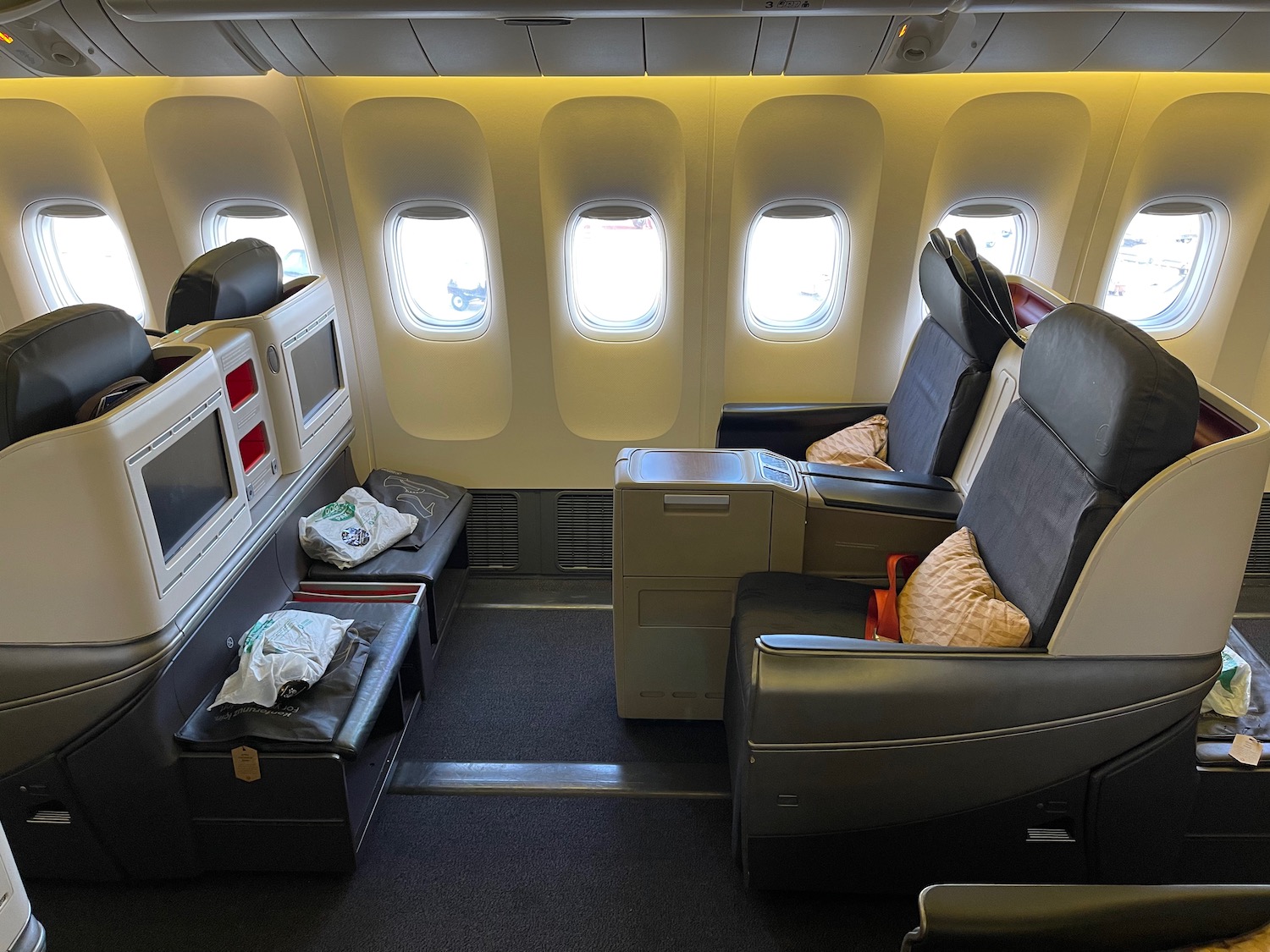 the inside of an airplane with seats and windows