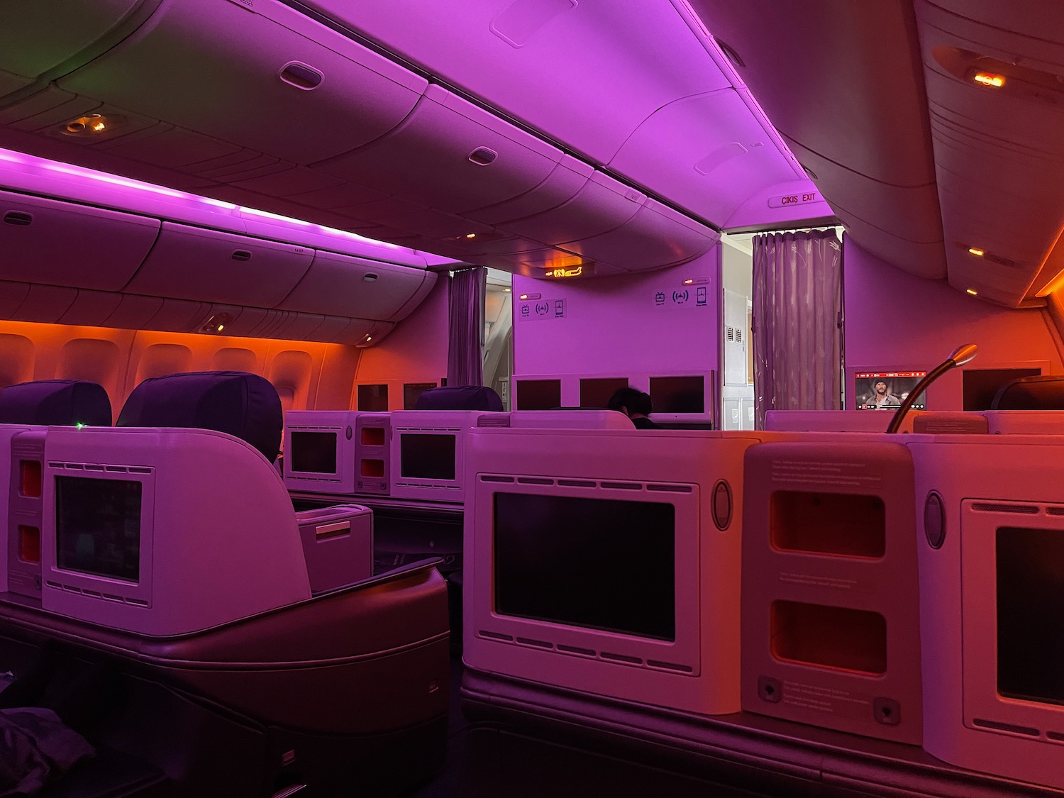 a room with tvs and seats in a plane