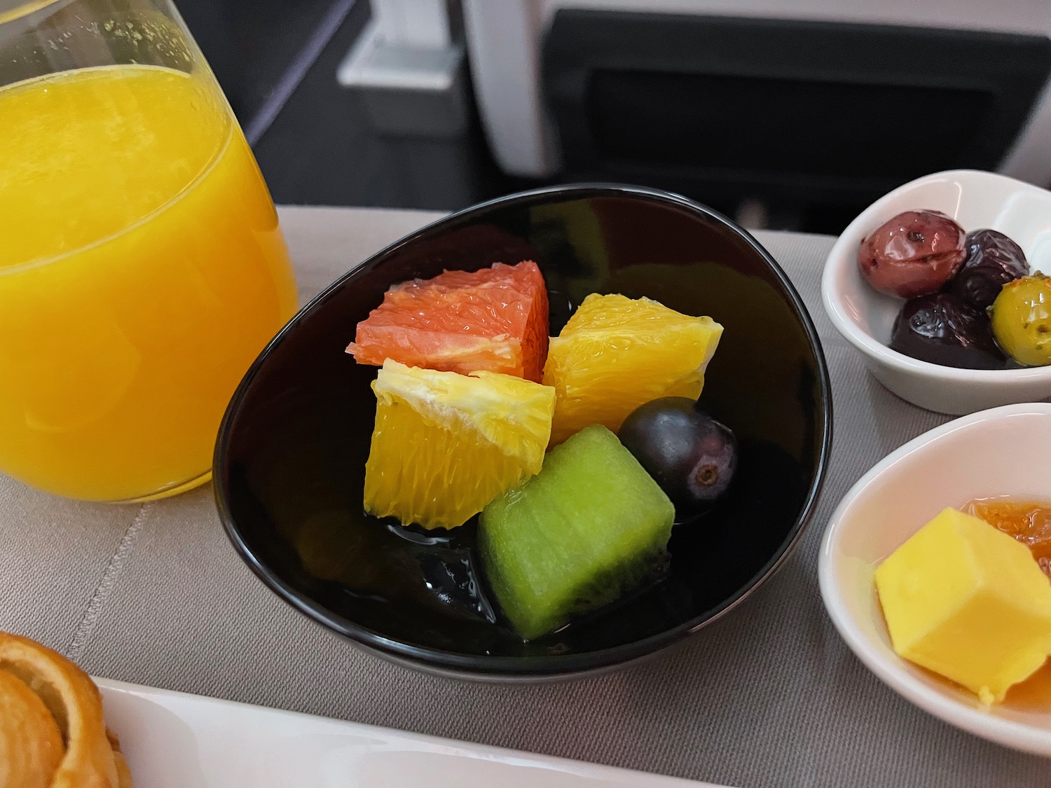 a bowl of fruit on a table