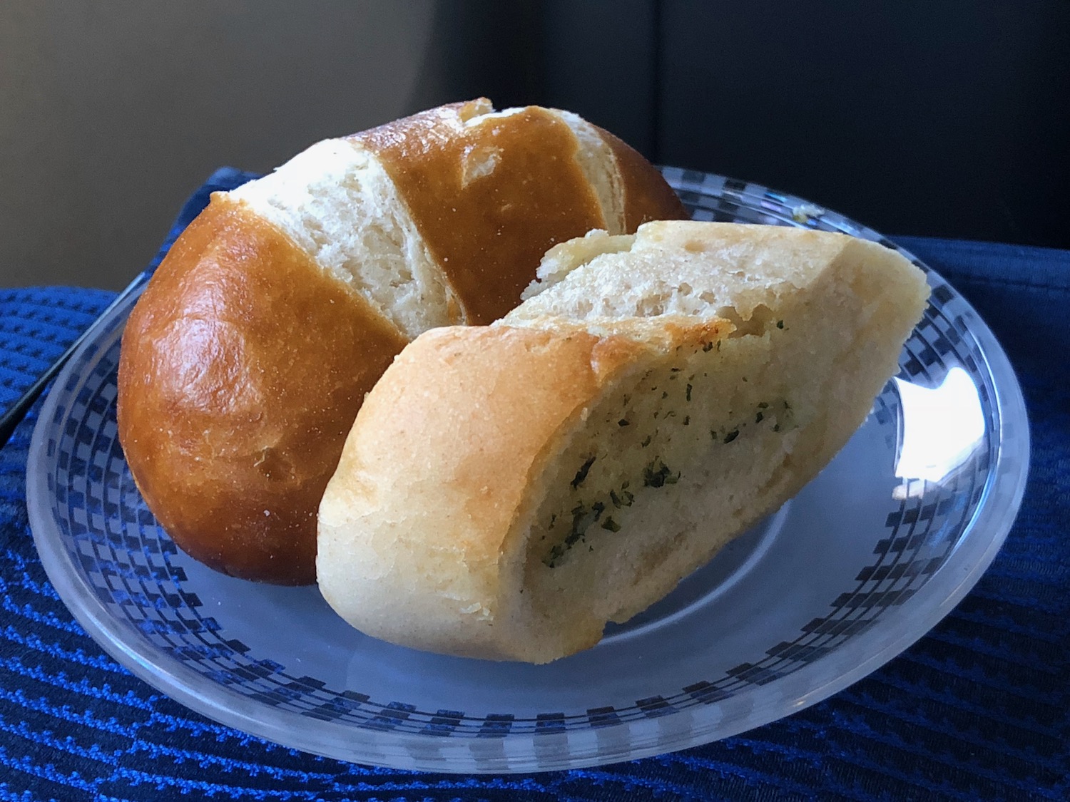 a plate of bread on a blue and white striped plate