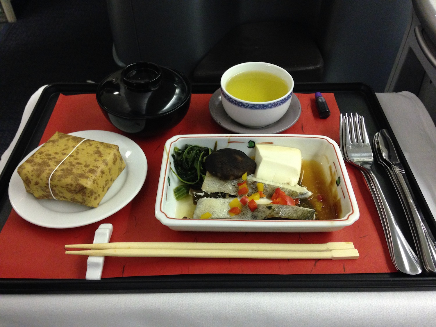 a tray with food and utensils on it