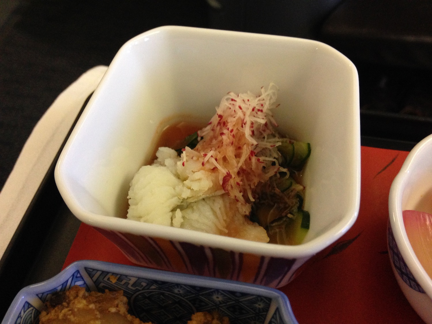 a bowl of food on a tray