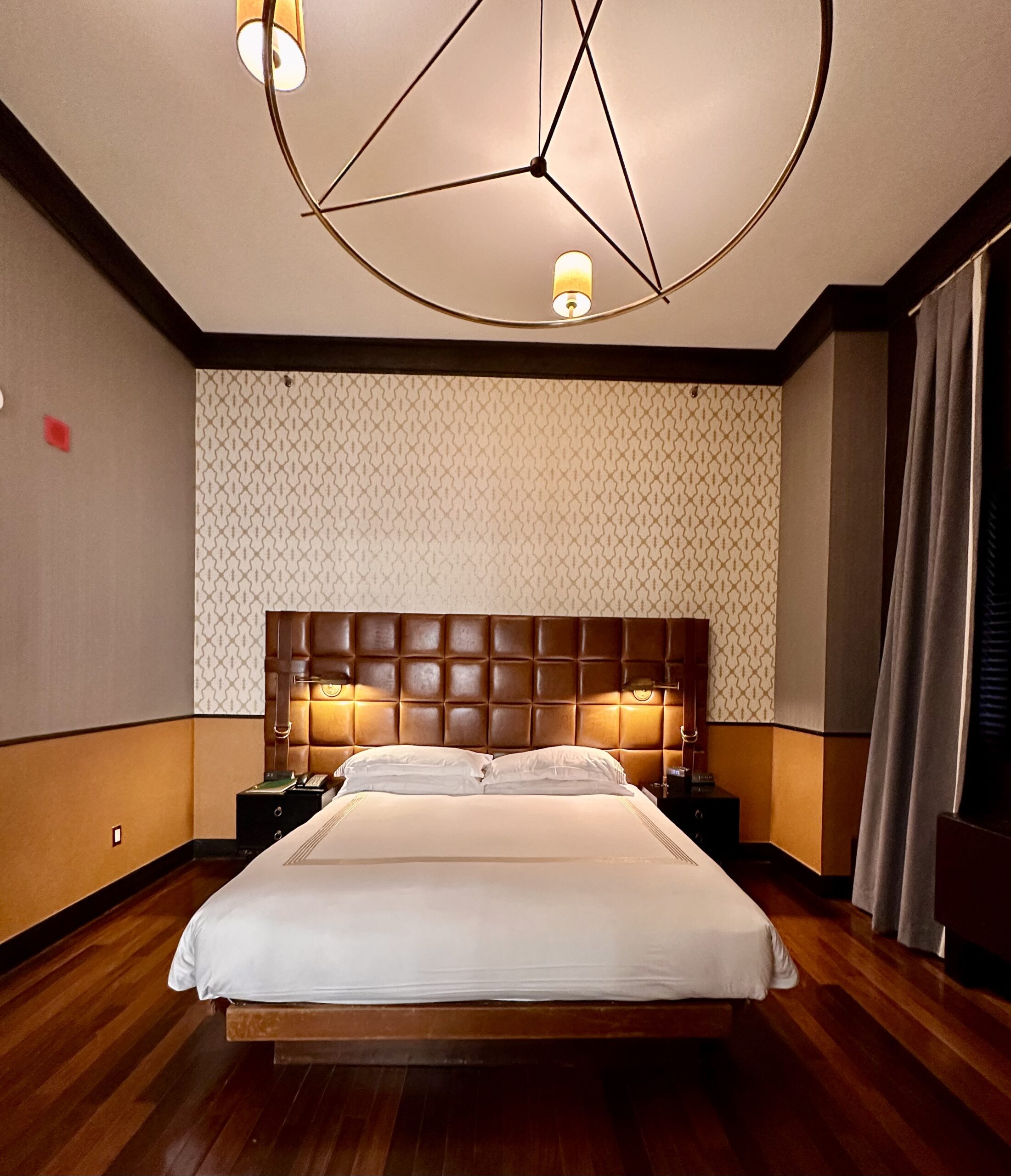 gild hall thompson suite bedroom with ceiling light