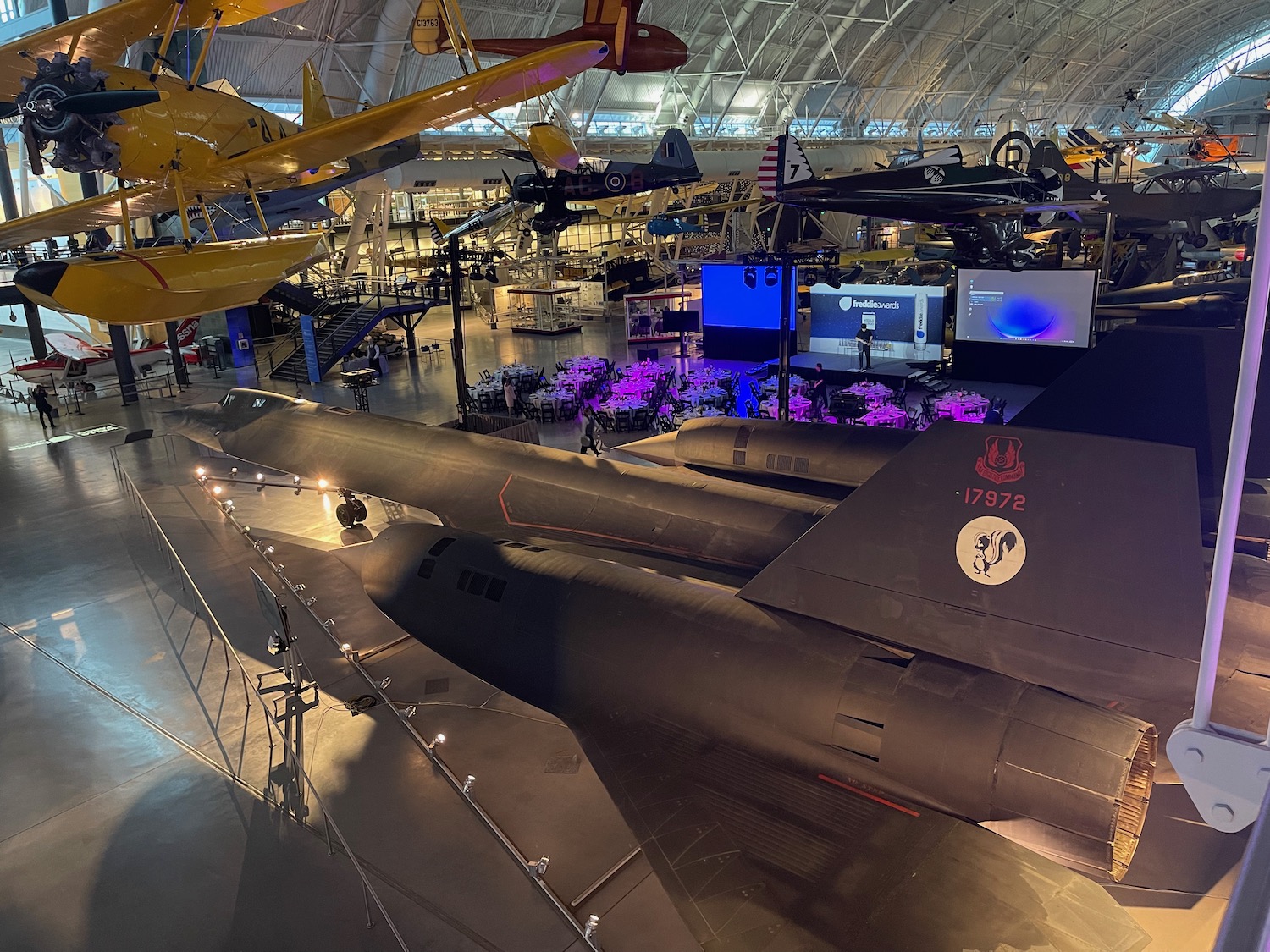 a large hangar with airplanes in it