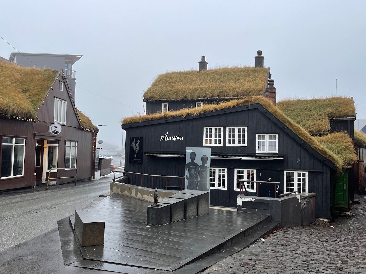 a building with grass on the roof