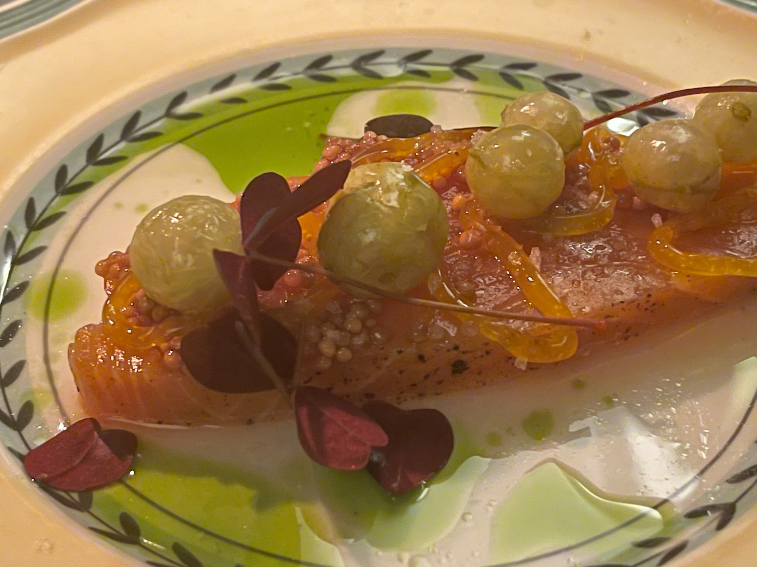 a plate of food with grapes on it