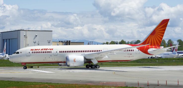 a white airplane on a runway