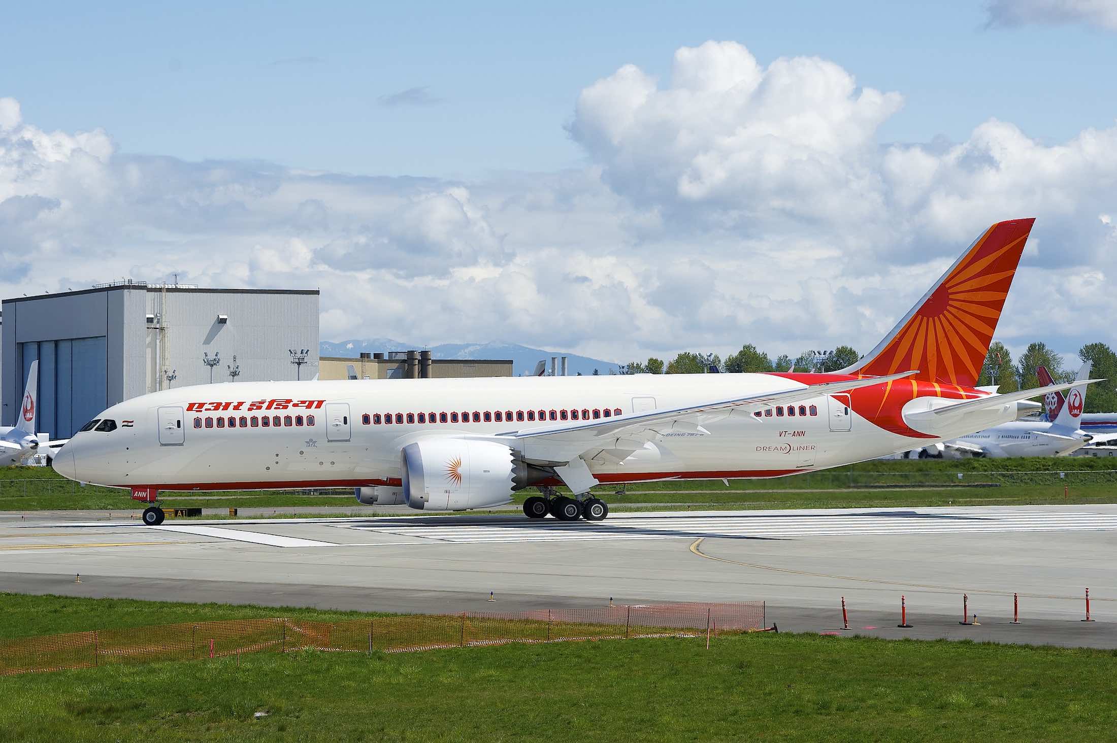 a white airplane on a runway