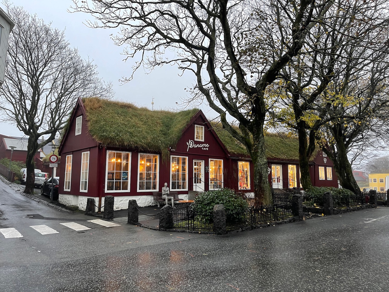 a building with grass on the roof