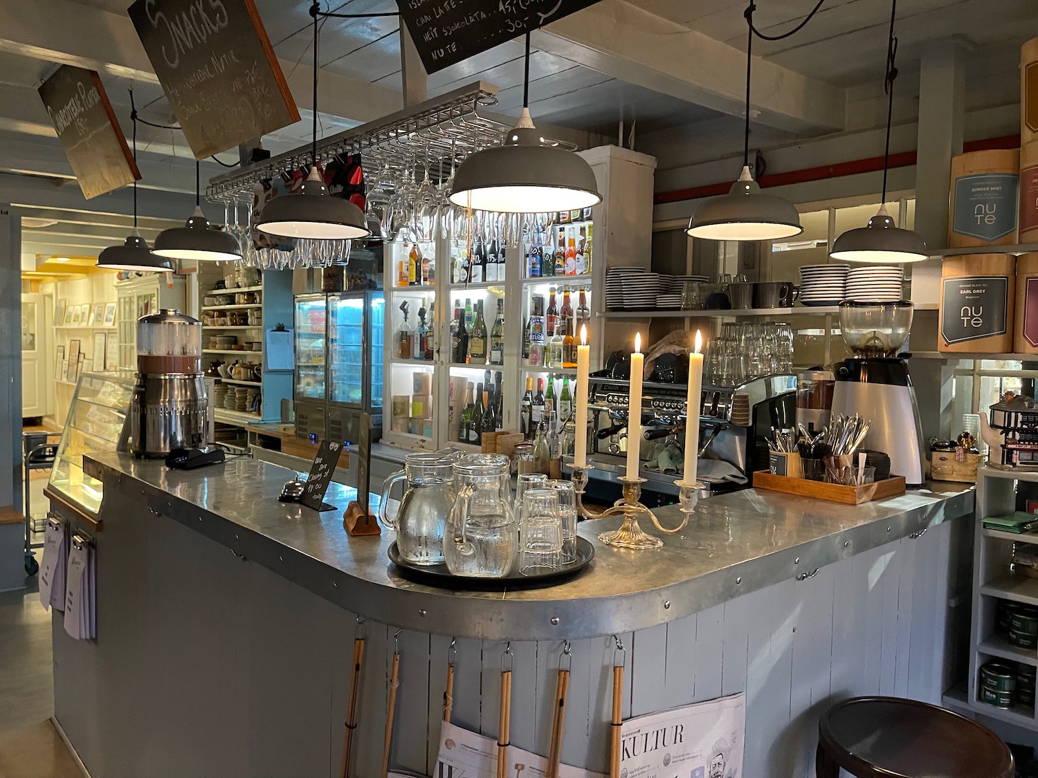 a bar with candles on the counter