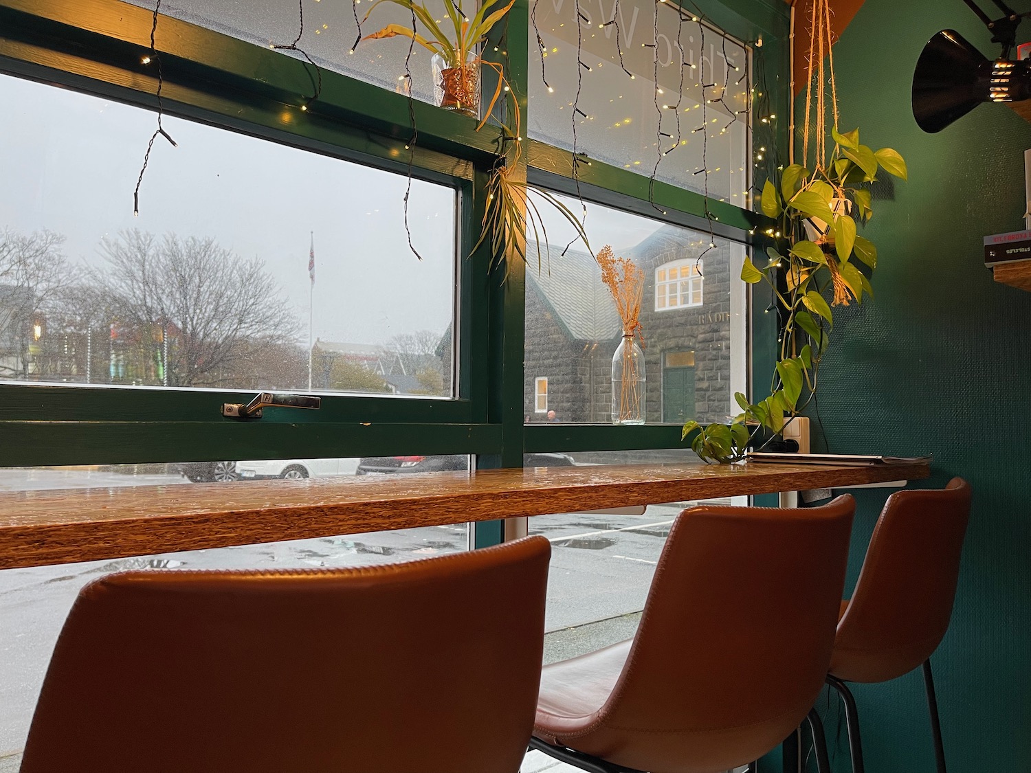 a table with chairs and a window