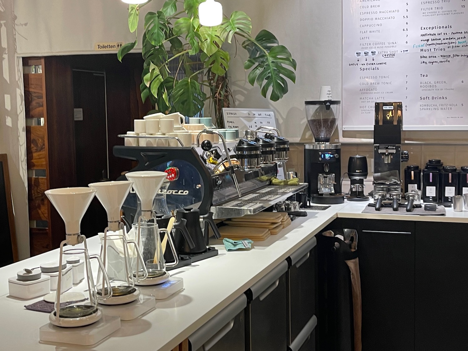 a coffee machine and coffee maker on a counter