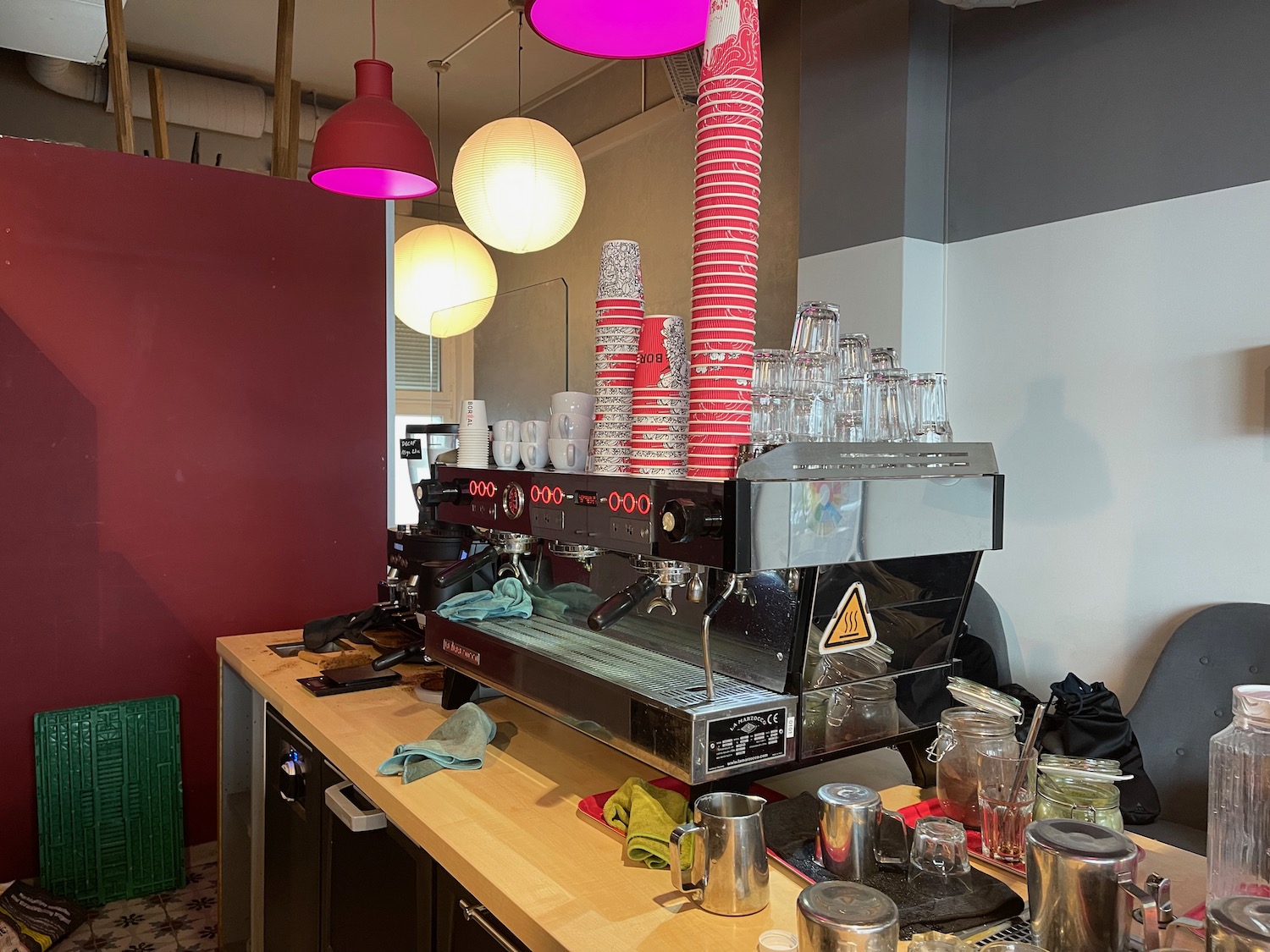 a coffee machine with cups on top of it