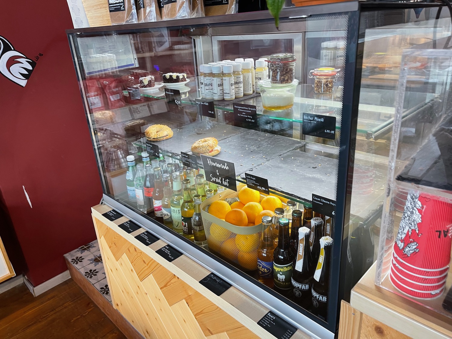 a display case with drinks and beverages