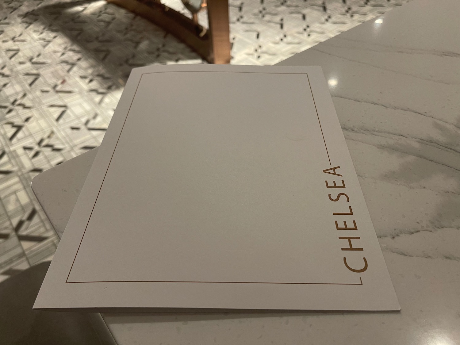 a white paper on a marble counter