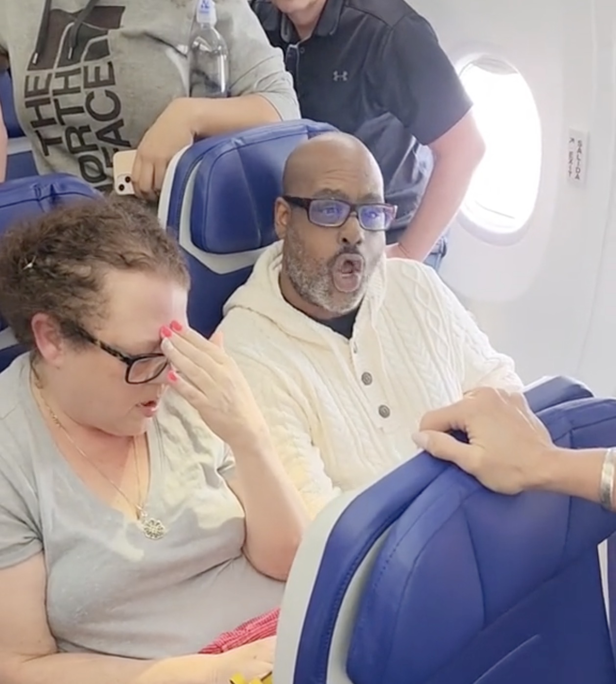 a group of people sitting on a plane