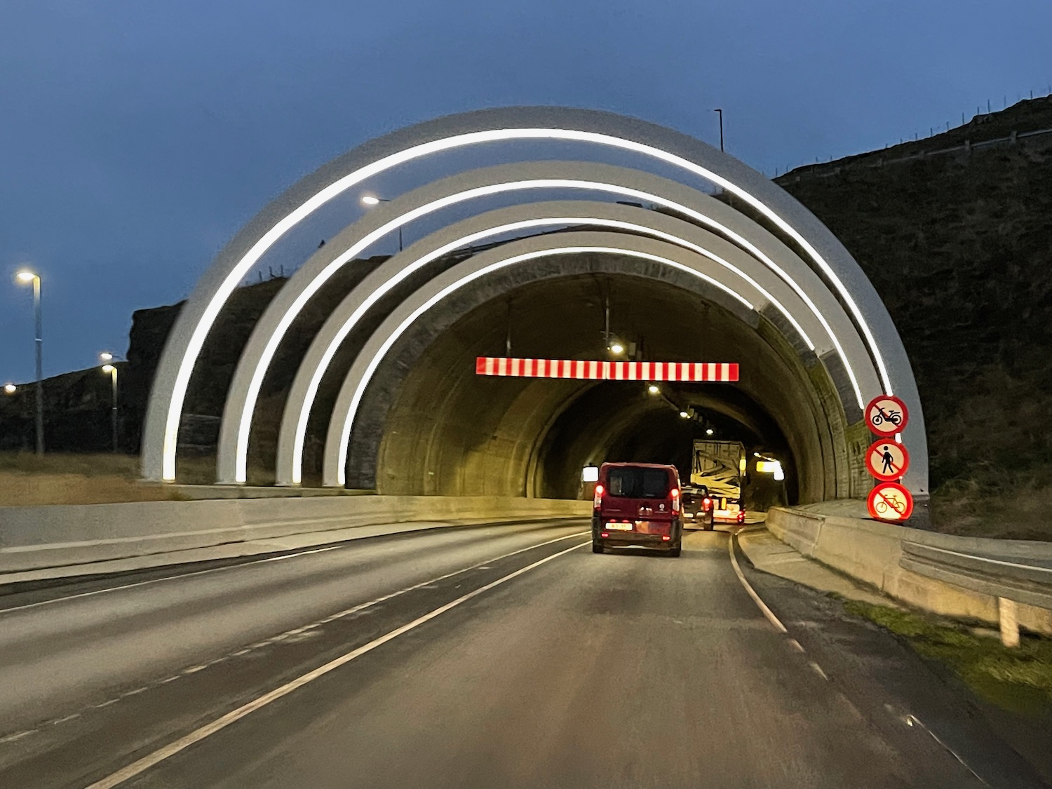 cars driving through a tunnel