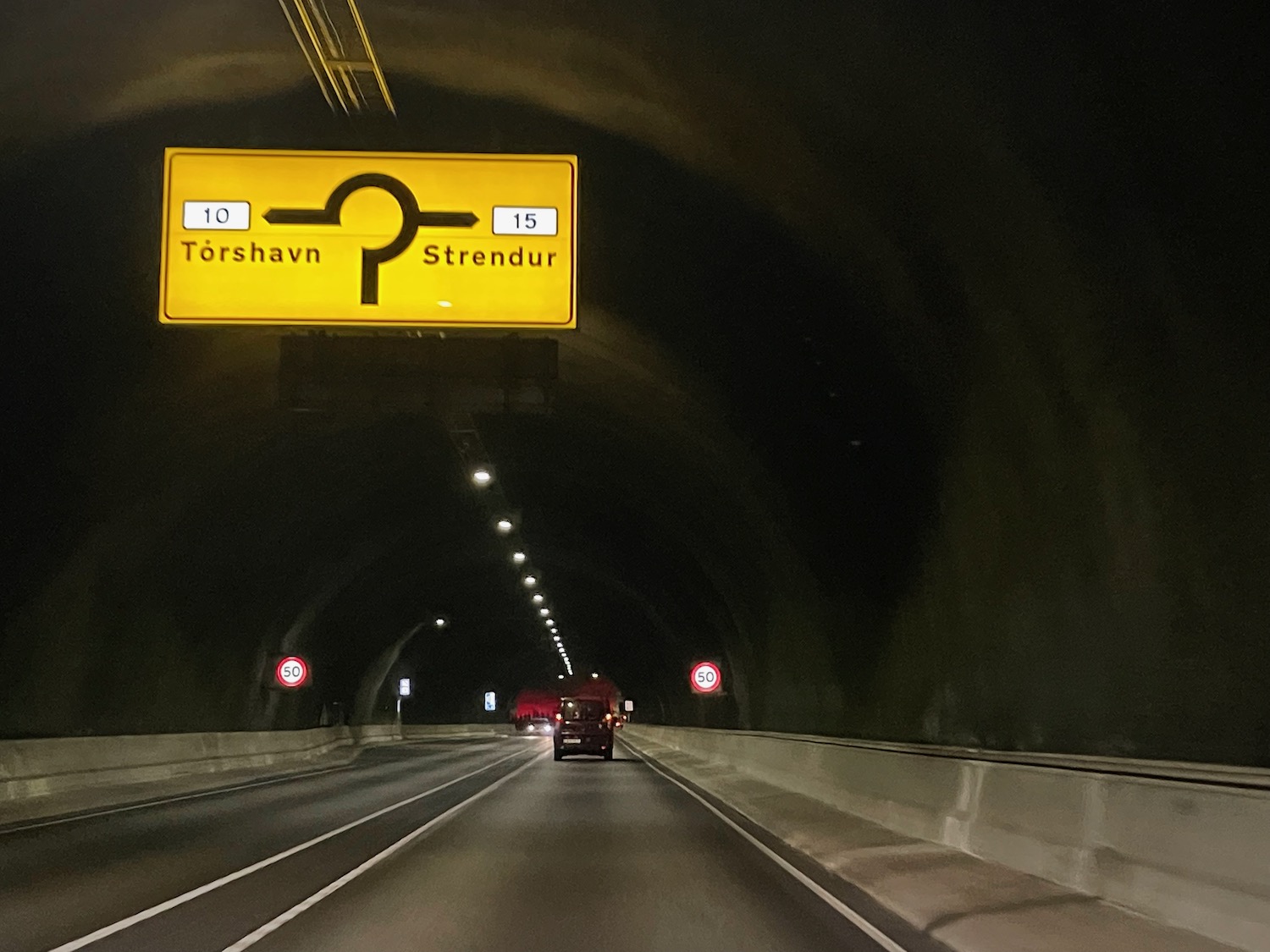 a road with a yellow sign