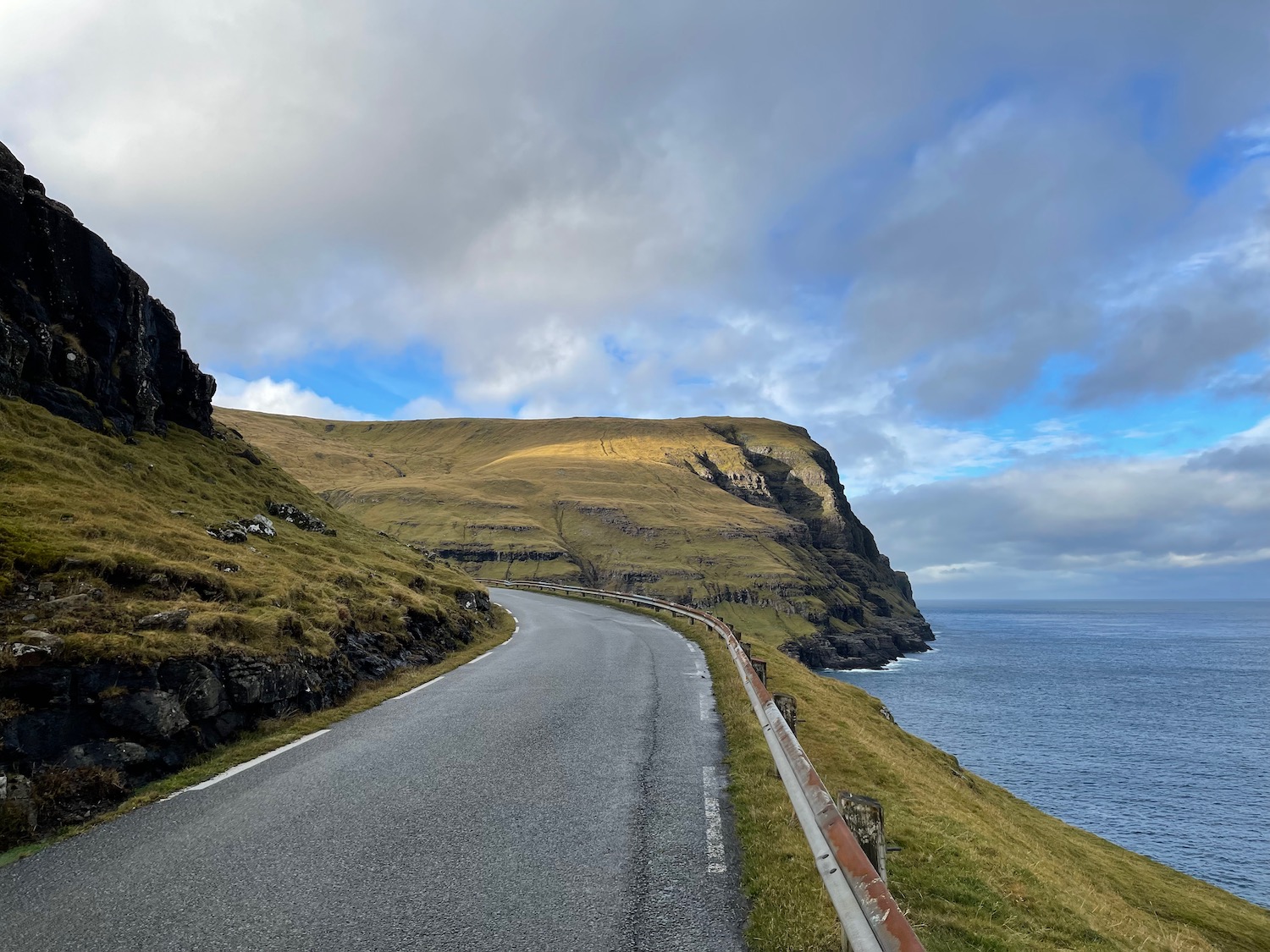 a road next to the water