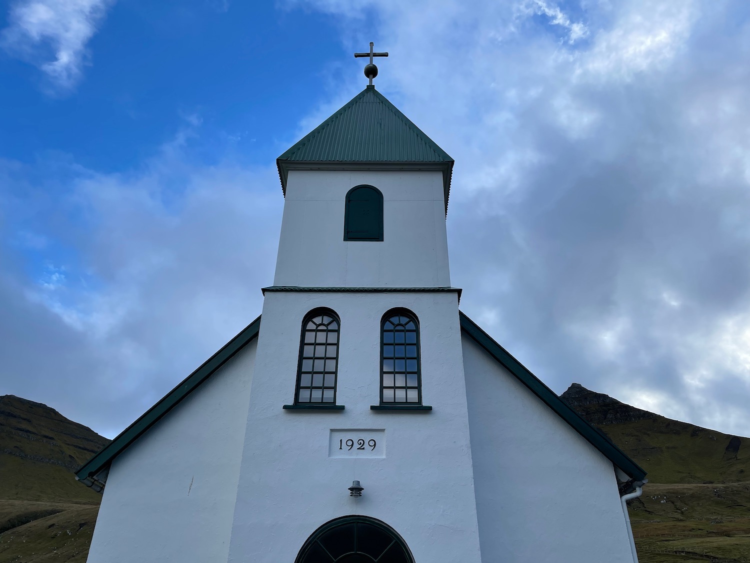 a white building with a cross on top