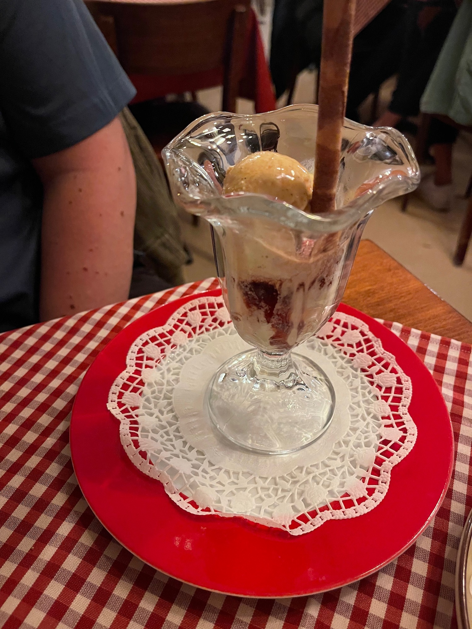 a glass cup with ice cream in it