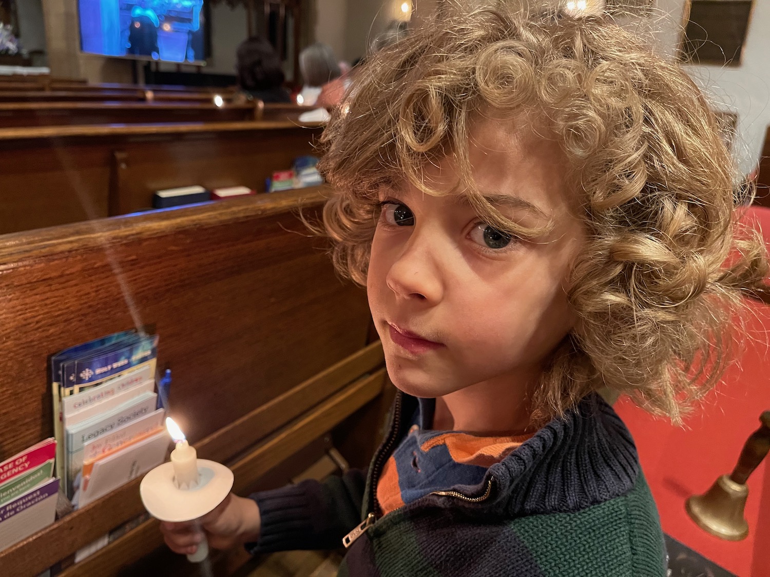 a boy holding a candle