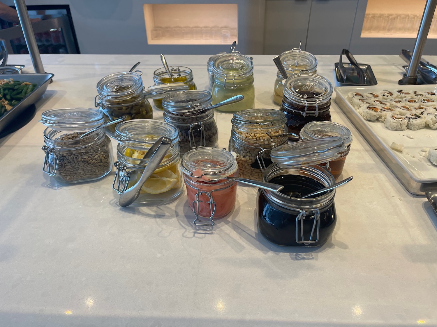 a group of jars with different food items on a table