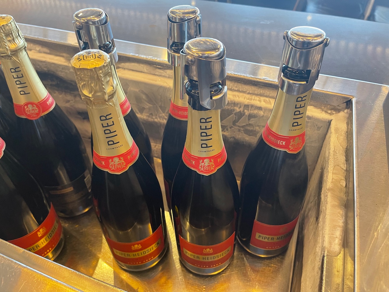 a group of bottles of champagne